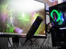black microphone beside black flat screen computer monitor