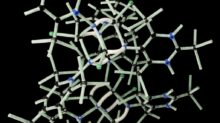 white plastic wire puzzle with black background