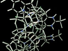 white plastic wire puzzle with black background