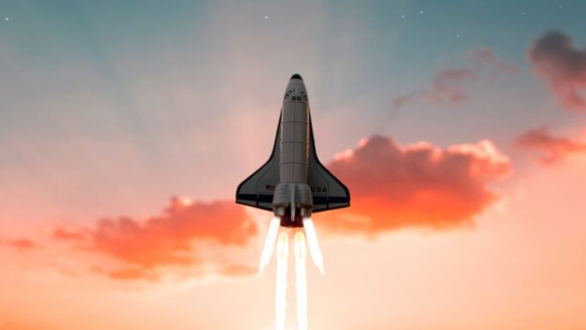 white and black plane flying in the sky during daytime