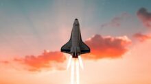white and black plane flying in the sky during daytime