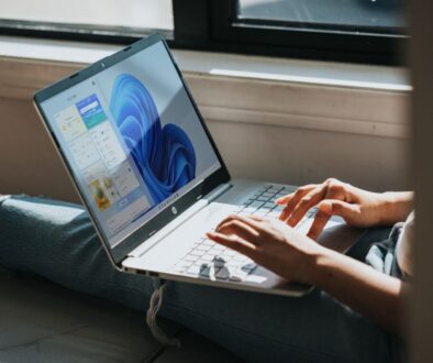person using Windows 11 computer on lap