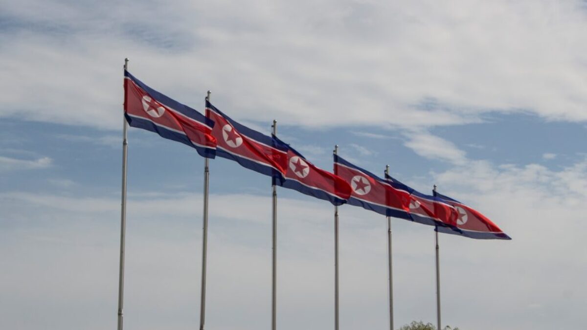 red and white flags on poles