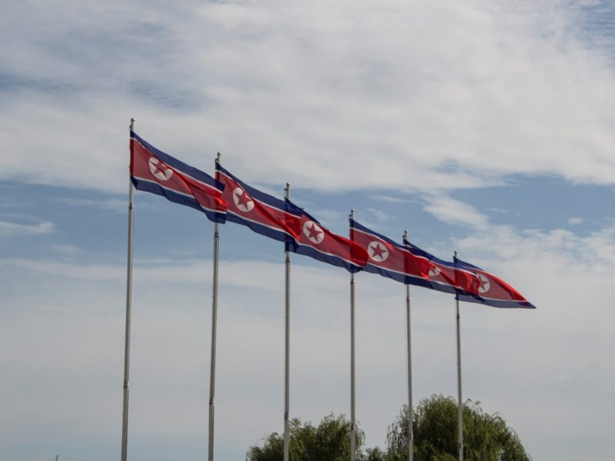 red and white flags on poles