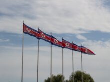red and white flags on poles