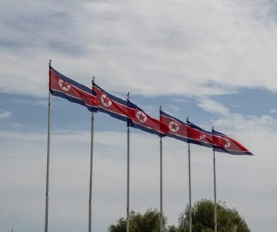 red and white flags on poles
