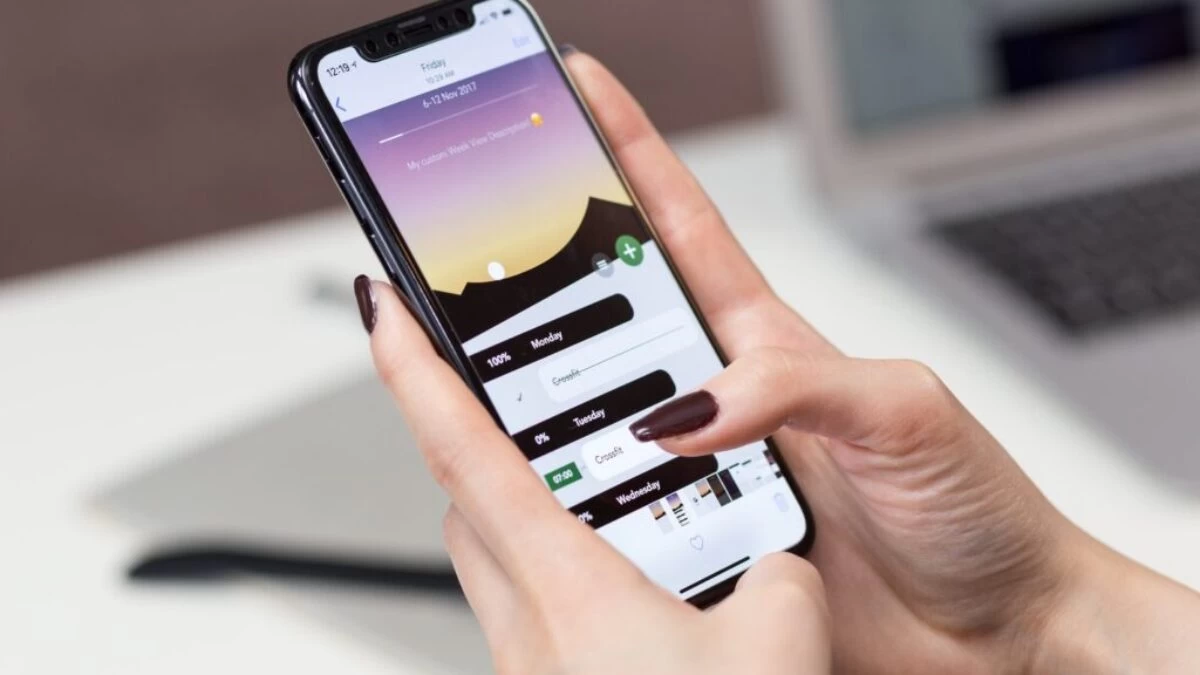 person hand holding iPhone X