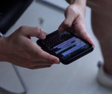 person holding black iphone 4