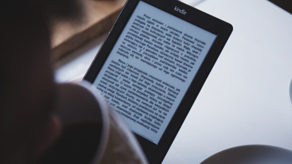 turned on black Amazon Kindle e-book reader