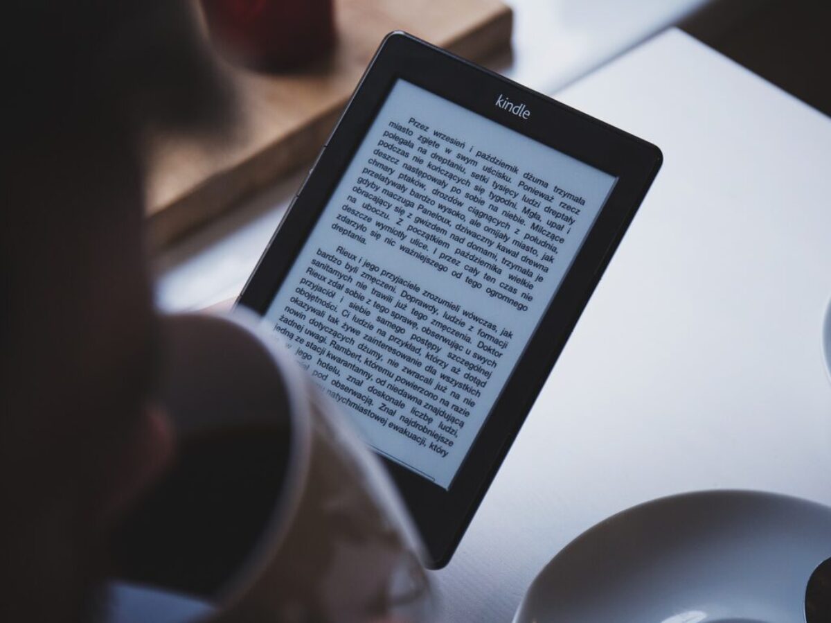 turned on black Amazon Kindle e-book reader