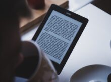 turned on black Amazon Kindle e-book reader