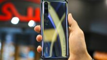 person holding silver samsung galaxys 6 edge