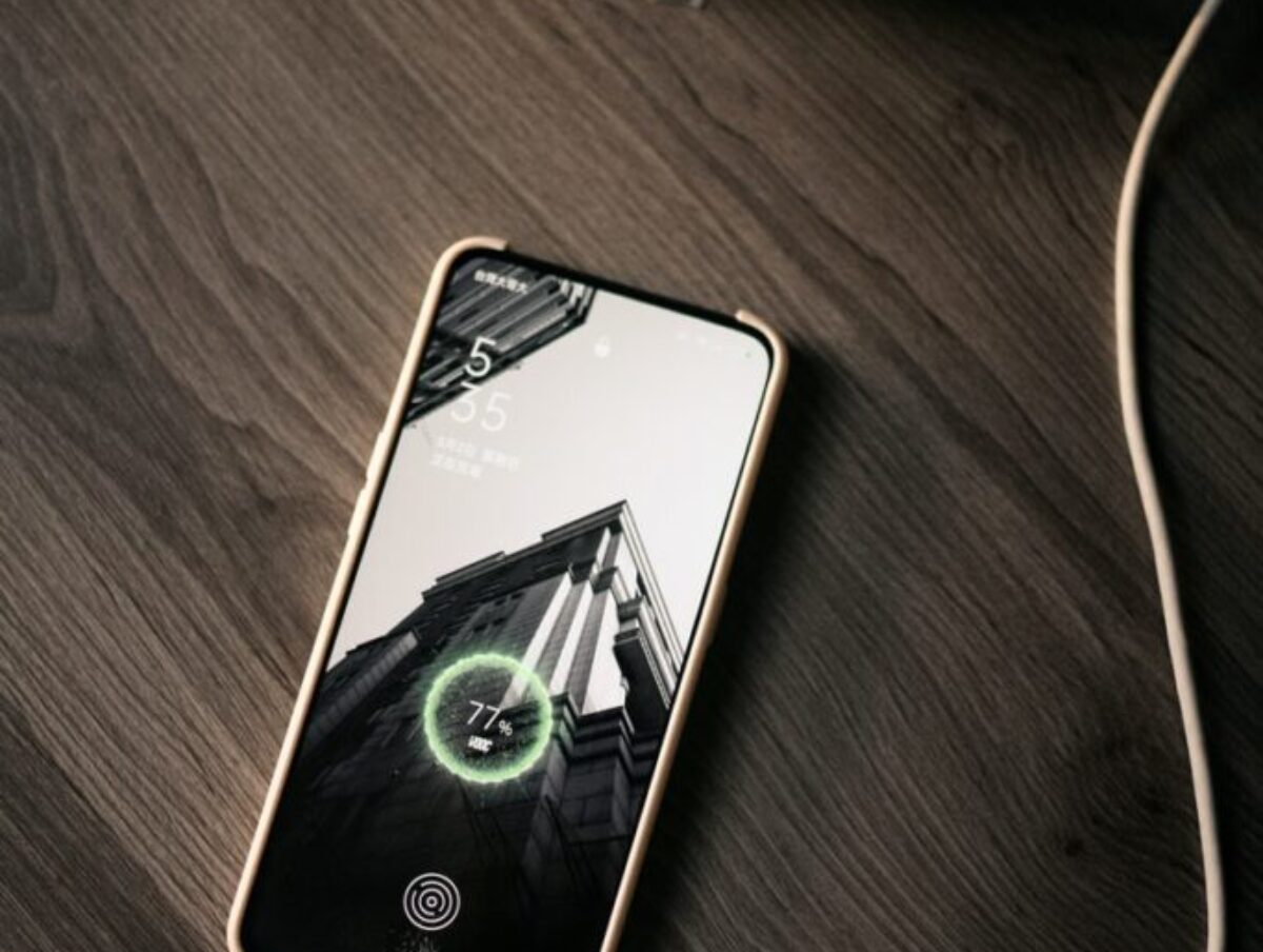 white iphone 5 c on brown wooden table