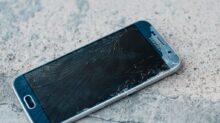 blue samsung android smartphone on gray marble table