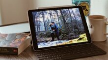 black ipad with keyboard on white table