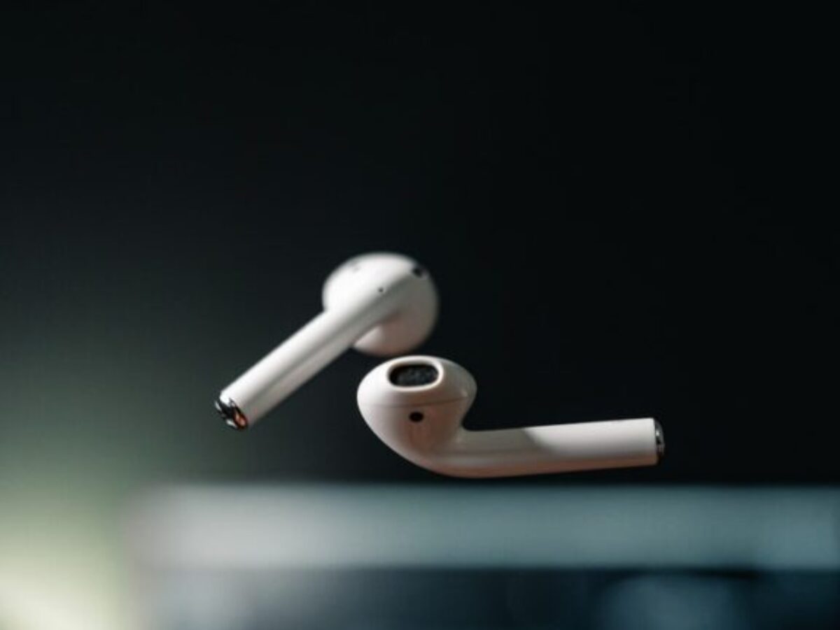 white apple earpods on black background