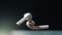 white apple earpods on black background