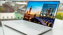 laptop on white table