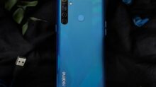 blue samsung android smartphone on blue textile