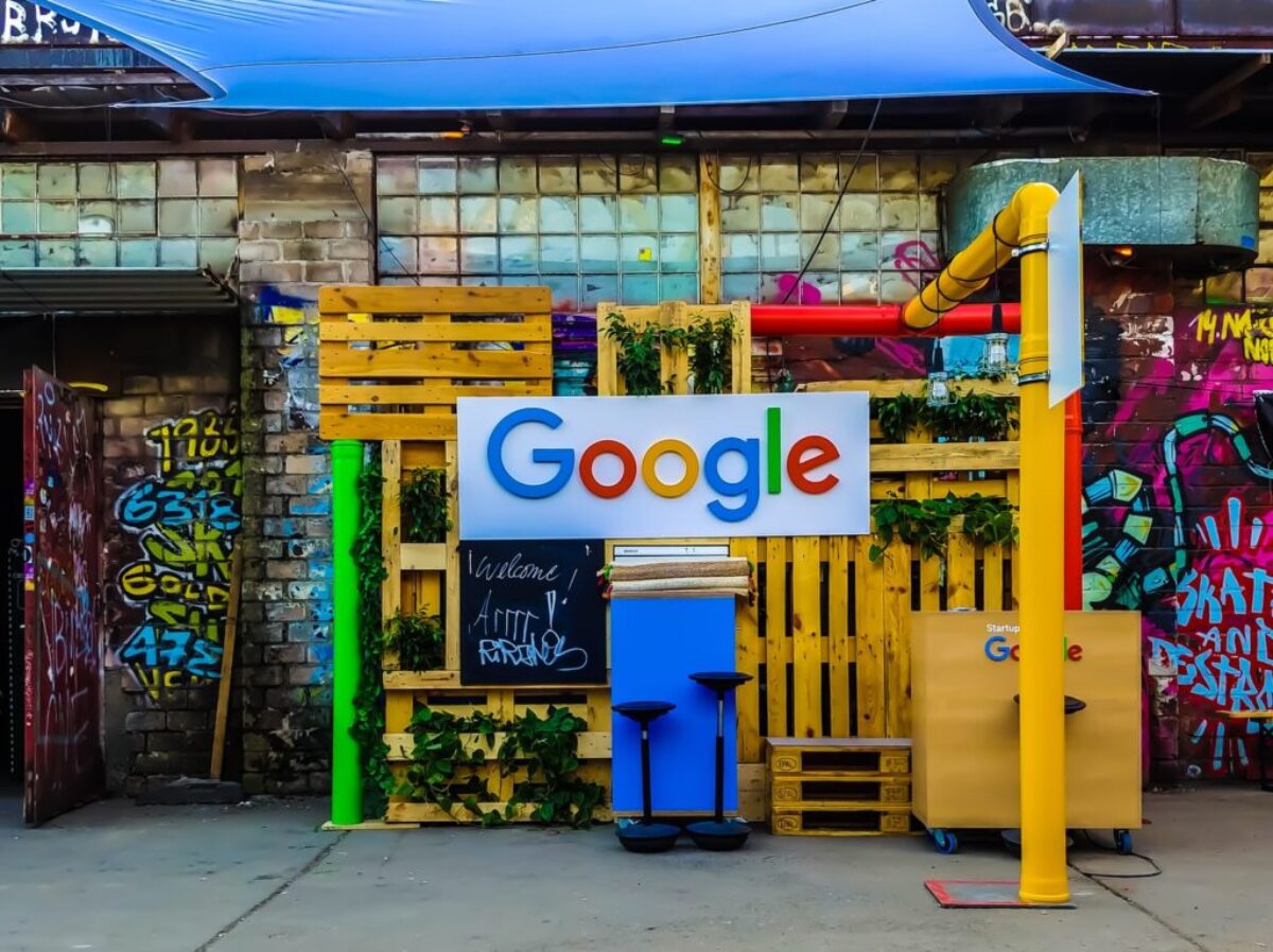 google logo beside building near painted walls at daytime