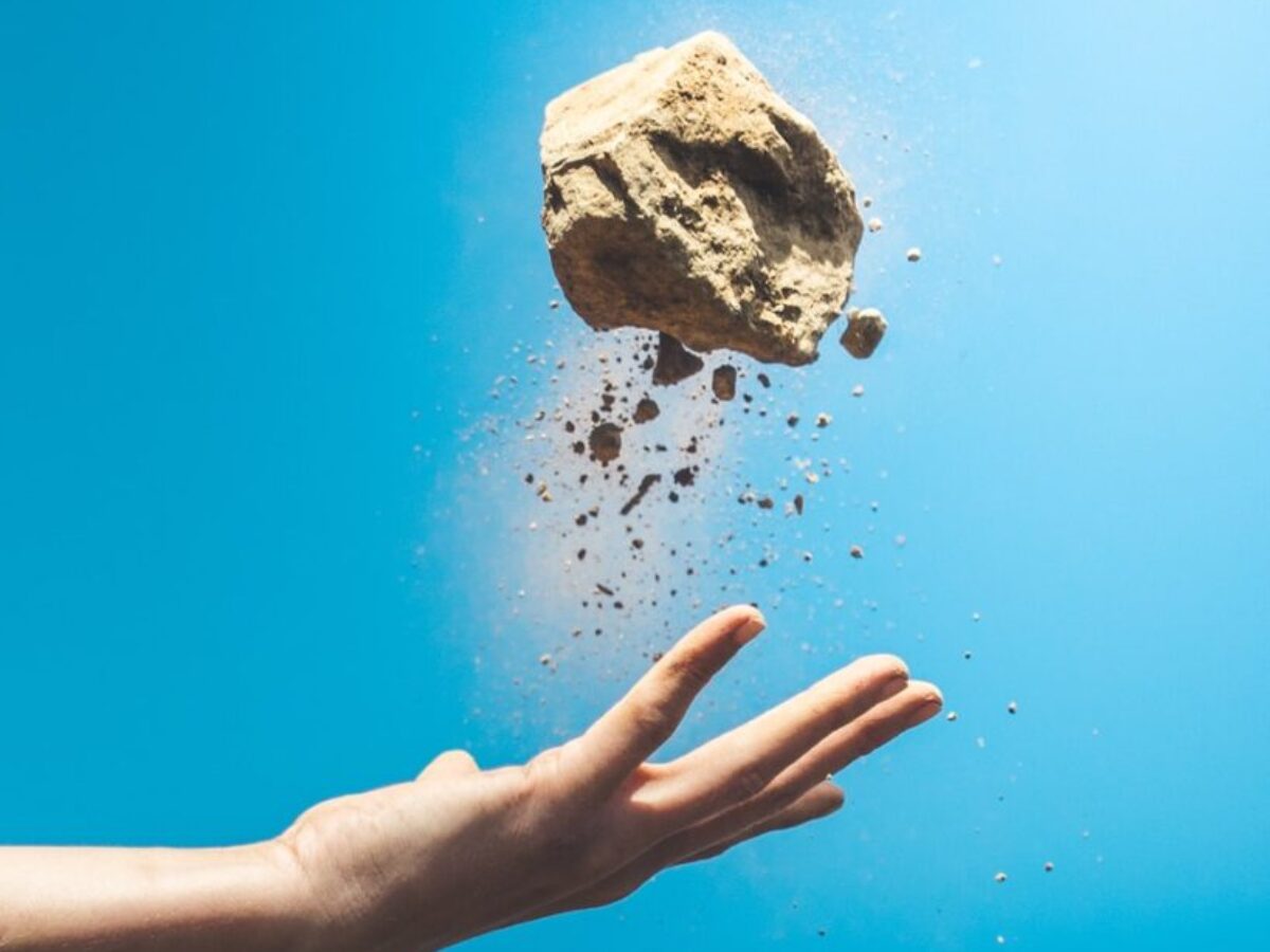 person throwing rock