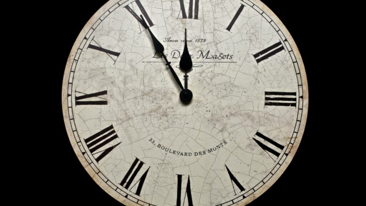 white and black analog clock at 10 10