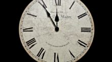white and black analog clock at 10 10