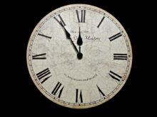 white and black analog clock at 10 10