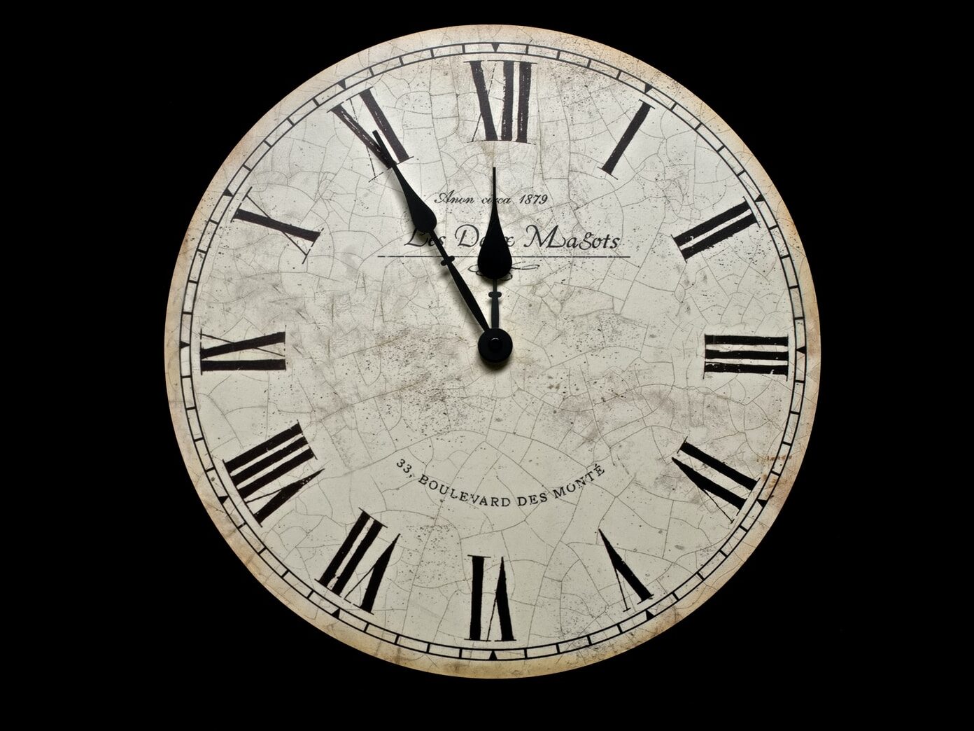 white and black analog clock at 10 10
