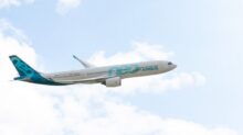 white and blue airplane flying during daytime