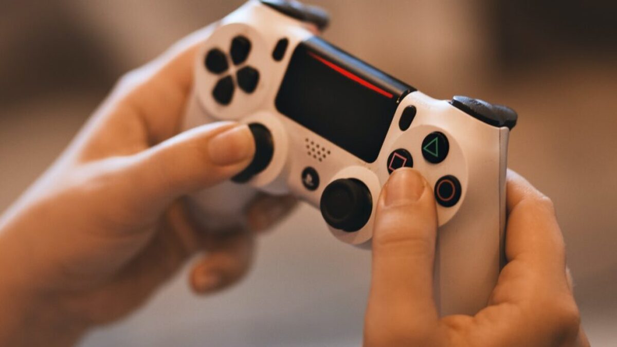 Person Holding Sony Ps4 Controller