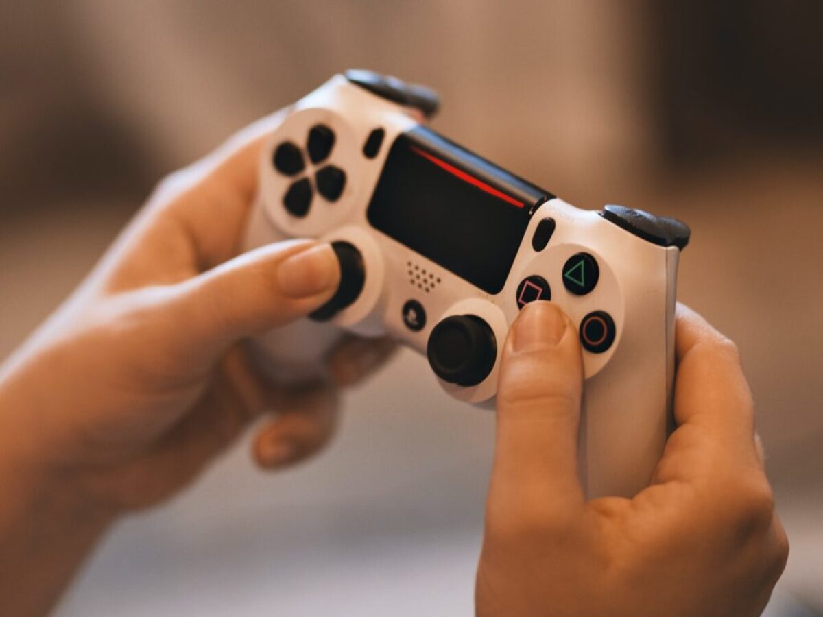 Person Holding Sony Ps4 Controller