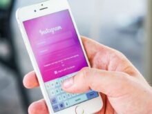 Person Holding Phone While Logging-in on Instagram Application