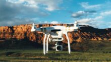 landscape photography of DJI Phantom flying midair in front of mountain