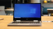 macbook pro on brown wooden table