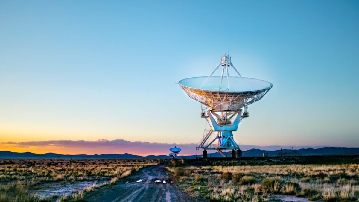 white radar telescope on grass field