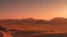 brown sand under blue sky during night time