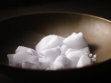 white sugar on gray bowl