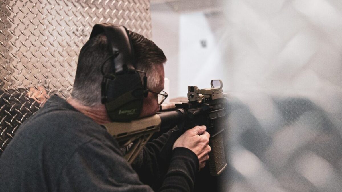 close-up photography of man doing shooting