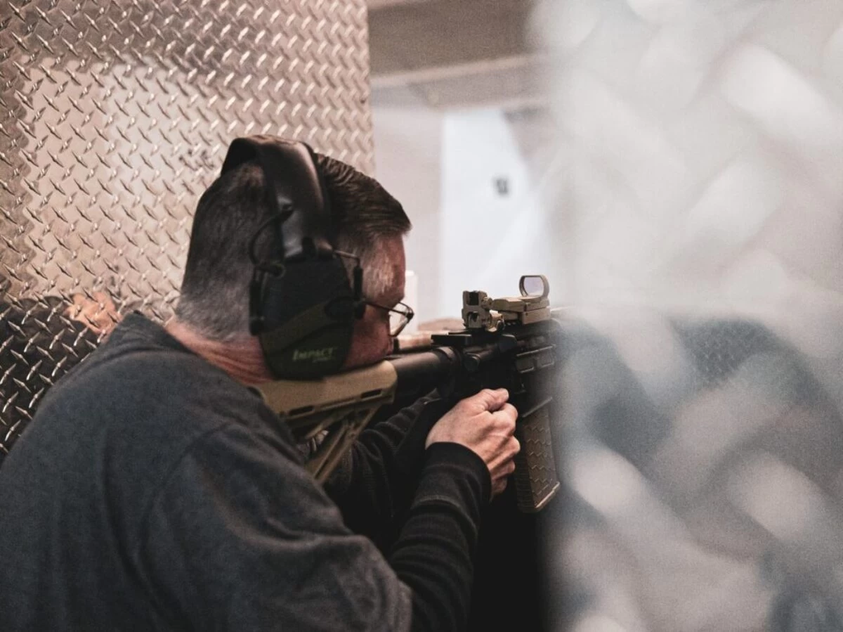close-up photography of man doing shooting