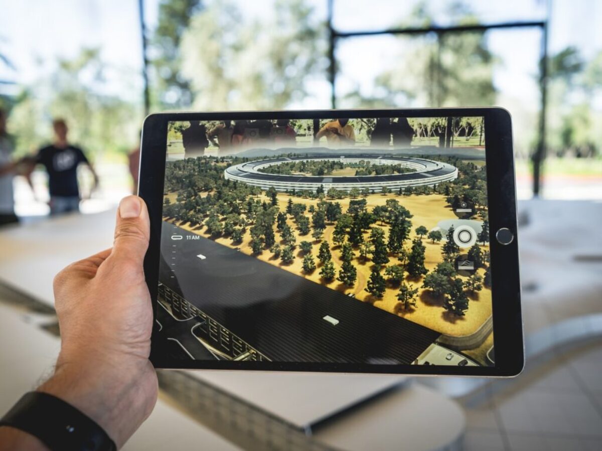 person holding black iPad