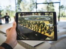 person holding black iPad