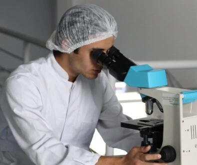 man sight on white microscope