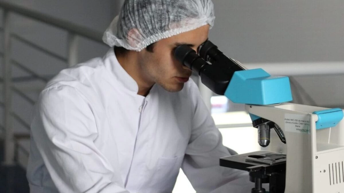 man sight on white microscope