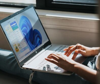 person using Windows 11 computer on lap