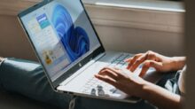 person using Windows 11 computer on lap
