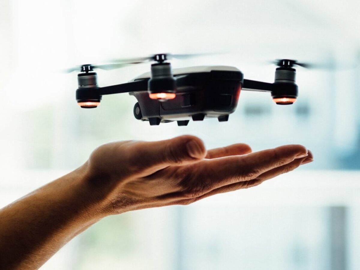 turned on black quadcopter drone