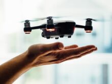 turned on black quadcopter drone