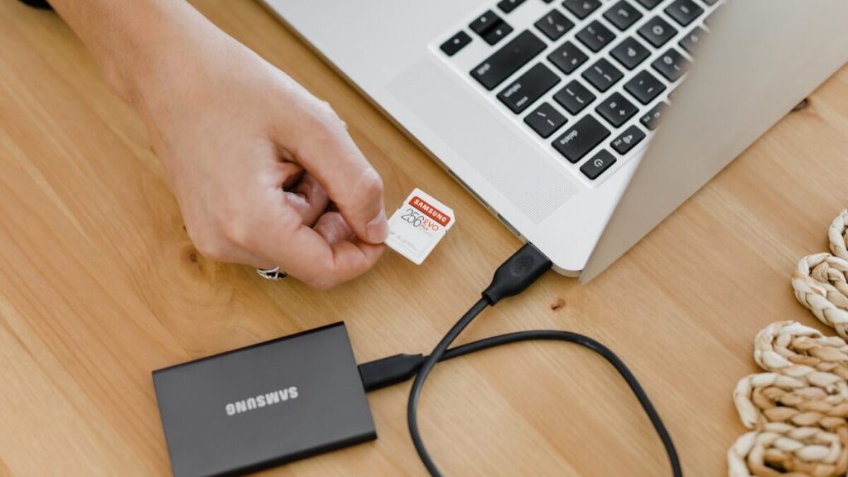 person holding black and silver laptop computer