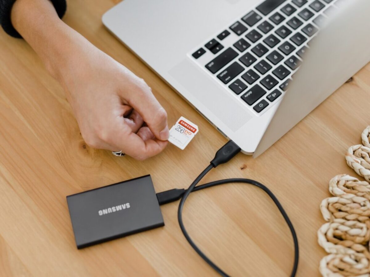 person holding black and silver laptop computer
